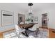 Elegant dining room featuring a modern table, stylish chairs, and decorative lighting, with hardwood floors at 1920 Cherry Ne St, St Petersburg, FL 33704