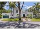 Stunning two-story home featuring lush landscaping, a barrel tile roof, and a rooftop terrace at 1920 Cherry Ne St, St Petersburg, FL 33704