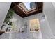Open and airy foyer with skylight, views to living and dining rooms, and unique tile flooring at 1920 Cherry Ne St, St Petersburg, FL 33704