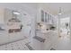 Beautiful kitchen with stainless steel range hood, white cabinetry, tiled backsplash and unique black and white tiled flooring at 1920 Cherry Ne St, St Petersburg, FL 33704