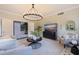 Cozy living room featuring tile floors, neutral tones, and a view into the entryway at 1920 Cherry Ne St, St Petersburg, FL 33704