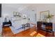 Sun-drenched main bedroom with hardwood floors and a cozy sitting area near the windows at 1920 Cherry Ne St, St Petersburg, FL 33704