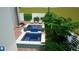 Aerial view of a modern pool and spa setup with a tiled deck and outdoor seating area at 1920 Cherry Ne St, St Petersburg, FL 33704
