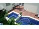 Inviting pool with spa and integrated steps, complemented by brick pavers and landscaped surroundings at 1920 Cherry Ne St, St Petersburg, FL 33704