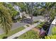Residential street features mature trees, sidewalks, and an American flag at 1920 Cherry Ne St, St Petersburg, FL 33704