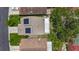 Aerial view of the home, showcasing the roof with solar panels, the backyard with screened patio, and proximity to amenities at 2254 Springrain Dr, Clearwater, FL 33763