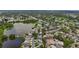 Bird's eye view of residential area with lakes and mature trees, close to shopping, schools, and entertainment at 2254 Springrain Dr, Clearwater, FL 33763