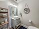 Bathroom with a modern sink, framed mirror, and rustic decor at 2254 Springrain Dr, Clearwater, FL 33763