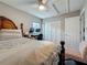 Bedroom with a wooden bed frame, computer desk, and closet for ample storage at 2254 Springrain Dr, Clearwater, FL 33763