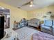 This bedroom features a ceiling fan, nice floors, and window for natural lighting at 2254 Springrain Dr, Clearwater, FL 33763