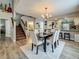 Dining room featuring stylish table and chairs, with views to kitchen and staircase at 2254 Springrain Dr, Clearwater, FL 33763