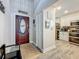 Inviting entryway featuring a wood-look floor, closet, and seamless access to the kitchen at 2254 Springrain Dr, Clearwater, FL 33763