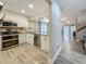 Bright kitchen featuring stainless steel appliances and a view of the living area at 2254 Springrain Dr, Clearwater, FL 33763