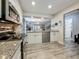 Bright kitchen showcasing granite countertops and stainless steel appliances, with an open layout at 2254 Springrain Dr, Clearwater, FL 33763