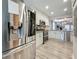 Stylish kitchen with stainless steel refrigerator, microwave, double oven and ample counter space at 2254 Springrain Dr, Clearwater, FL 33763