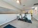 Upstairs workout area featuring neutral paint, ceiling fan, and exercise equipment at 2254 Springrain Dr, Clearwater, FL 33763