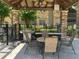 Community outdoor BBQ area under a gazebo, perfect for entertaining guests and relaxing at 2500 Winding Creek Blvd # B105, Clearwater, FL 33761