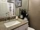 Bathroom vanity with granite countertop and modern fixtures at 2500 Winding Creek Blvd # B105, Clearwater, FL 33761