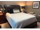 Bedroom featuring a bed, nightstands, and decorative elements at 2500 Winding Creek Blvd # B105, Clearwater, FL 33761