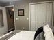 Cozy bedroom featuring a comfortable bed and a closet for ample storage space at 2500 Winding Creek Blvd # B105, Clearwater, FL 33761