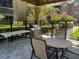 Community outdoor BBQ area with stainless steel grill and tables, perfect for gatherings at 2500 Winding Creek Blvd # B105, Clearwater, FL 33761