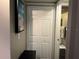 Hallway showcases a closet with traditional doors, offering convenient storage solutions at 2500 Winding Creek Blvd # B105, Clearwater, FL 33761
