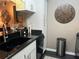Efficient kitchen space with granite counters, stainless steel faucet and adjacent dinette area at 2500 Winding Creek Blvd # B105, Clearwater, FL 33761