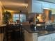 Open concept living area flowing seamlessly from the kitchen and dinette area at 2500 Winding Creek Blvd # B105, Clearwater, FL 33761