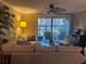 Cozy living room with access to a private outdoor patio and comfortable furniture at 2500 Winding Creek Blvd # B105, Clearwater, FL 33761