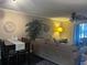Cozy living room featuring dining table, comfortable sofa, and decorative elements at 2500 Winding Creek Blvd # B105, Clearwater, FL 33761