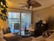 Inviting living room with a ceiling fan and sliding glass doors leading to the outdoor patio space at 2500 Winding Creek Blvd # B105, Clearwater, FL 33761