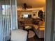 Living room with a view to the open kitchen, dining area, and sliding glass doors leading to the patio at 2500 Winding Creek Blvd # B105, Clearwater, FL 33761