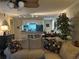 Open-concept living room and kitchen with a view of the breakfast bar and dining area, and a large comfy sofa at 2500 Winding Creek Blvd # B105, Clearwater, FL 33761