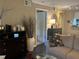 Inviting living room featuring stylish decor, a ceiling fan, and a view to other areas of the house at 2500 Winding Creek Blvd # B105, Clearwater, FL 33761