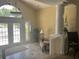Elegant lobby area with a staircase, decorative plants, seating, and a bright entryway at 2500 Winding Creek Blvd # B105, Clearwater, FL 33761