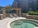 Relaxing pool area with stone accents and loungers for residents to enjoy the outdoors at 2500 Winding Creek Blvd # B105, Clearwater, FL 33761