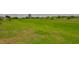 Expansive green lawn extends behind this property in a picturesque, golf course community at 2609 Lancaster Dr, Sun City Center, FL 33573