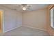 Bedroom featuring carpet, a ceiling fan, and a window at 2609 Lancaster Dr, Sun City Center, FL 33573