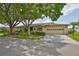 Charming one-story home with mature landscaping, a two-car garage and a paved driveway at 2609 Lancaster Dr, Sun City Center, FL 33573