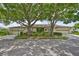 A one-story home with mature landscaping and a two-car garage in a quiet neighborhood at 2609 Lancaster Dr, Sun City Center, FL 33573