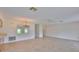 Spacious open-concept living and dining area with tile flooring and modern fixtures at 2609 Lancaster Dr, Sun City Center, FL 33573