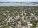 An aerial image of a tranquil neighborhood near the coast and bay area with plenty of trees at 2718 Boca Ciega N Dr, St Petersburg, FL 33710