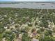 An aerial shot featuring a community with swimming pools and tree coverage near coastal waters at 2718 Boca Ciega N Dr, St Petersburg, FL 33710