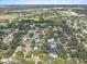 Aerial view showcases the property's pool and backyard nestled within a lush neighborhood at 2718 Boca Ciega N Dr, St Petersburg, FL 33710
