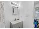Clean bathroom featuring a vanity sink and a large mirror at 2718 Boca Ciega N Dr, St Petersburg, FL 33710