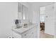 Bright bathroom with a vanity, ample counter space, sink and medicine cabinet at 2718 Boca Ciega N Dr, St Petersburg, FL 33710