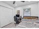Bedroom featuring a bed, closet, desk, and chair at 2718 Boca Ciega N Dr, St Petersburg, FL 33710
