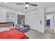 Cozy bedroom with wood flooring, ample storage space, and a comfy couch at 2718 Boca Ciega N Dr, St Petersburg, FL 33710