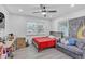 Bright bedroom with ample natural light, a ceiling fan, and wood flooring at 2718 Boca Ciega N Dr, St Petersburg, FL 33710