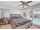 Bedroom with a wood-framed bed, a pool view, and lots of natural light at 2718 Boca Ciega N Dr, St Petersburg, FL 33710